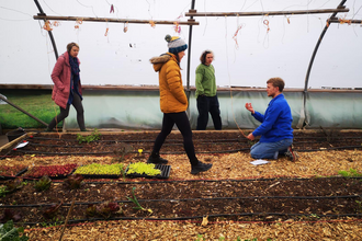 Grow Leader student in a polytunnel