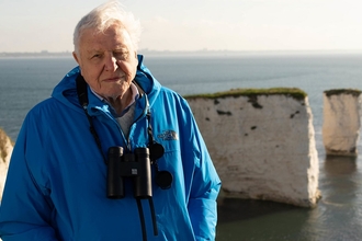 Sir David Attenborough introduces the Wild Isles series at dawn at Old Harry's Rocks, Dorset 