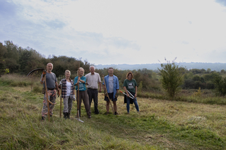 Members of the Wild CATS at Hengrove Mounds smiling for the camera 