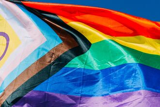 The rainbow pride flag blowing in the wind
