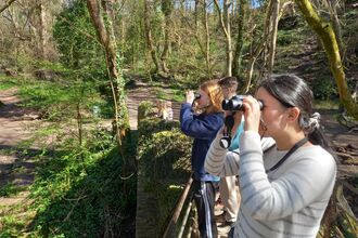 young people with binoculars