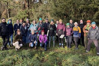 The 2025/2026 cohort of Wildlife Champions, stood together in a woodland area
