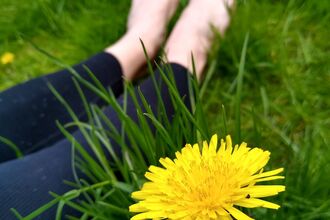 Barefoot lying in grass