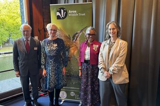 The Vice Lord-Lieutenant of Somerset, Leah McNally, Lord-Lieutenant of Bristol and Lara Burch stand next to one another in front of an Avon Wildlife Trust banner