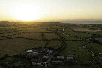 Drone image of Ebdon Farm at sunset