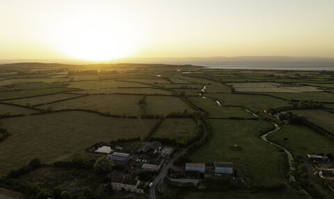 Drone image of Ebdon Farm at sunset