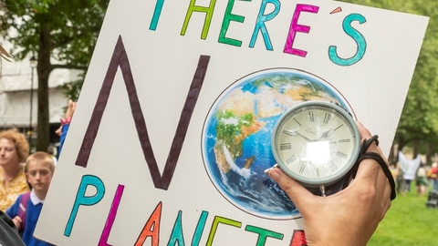 A sign that says "there's no planet B"
