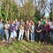 A group of 15 people in a willow circle in nature