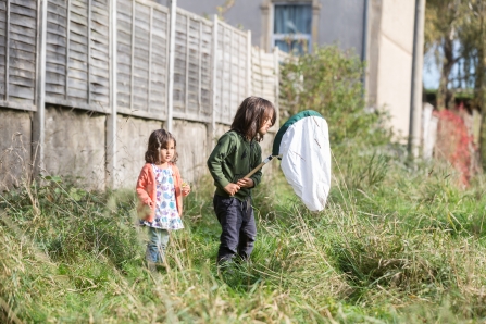 Boy and girl with sweep net