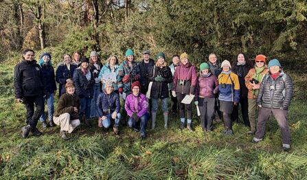 The 2025/2026 cohort of Wildlife Champions, stood together in a woodland area