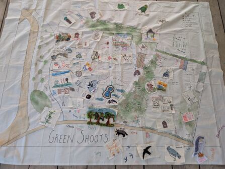A fabric map of the Green Shoots site with future ideas on in various craft materials - felting, pen drawings and lino-printing - including images of a pond, reptile habitats and areas of tree planting