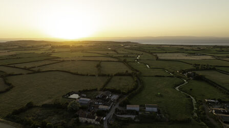 Drone image of Ebdon Farm at sunset