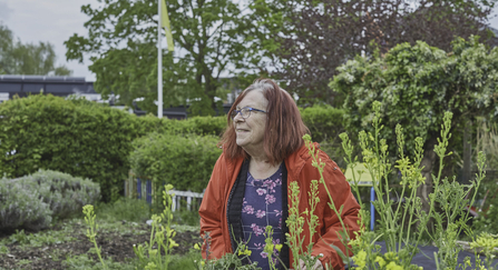 A woman in a garden, enjoying nature