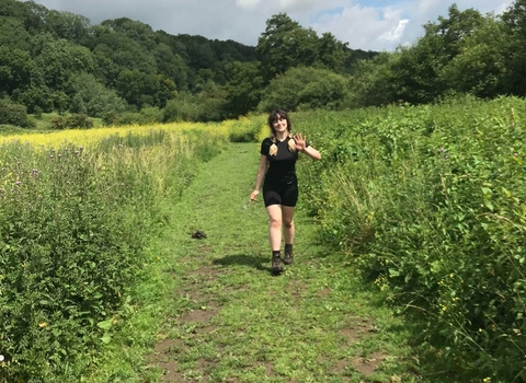 Holly walking in a field