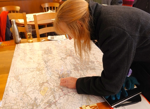 Lady interacts with map