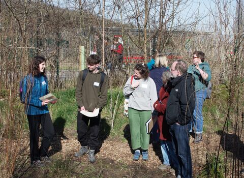 Members of the Youth Leadership Group talking to local residents during a tour of Grow Wilder