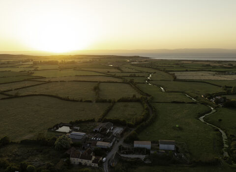 Drone image of Ebdon Farm at sunset