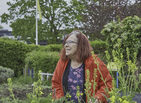 A woman in a garden, enjoying nature